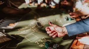 Live blackjack table with dealer and multiple player positions visible on screen